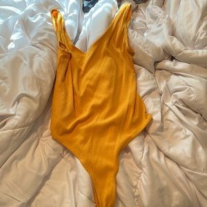 Yellow body suit